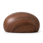 Smooth, dome-shaped dark brown wood object with a subtle grain pattern and a narrow opening on top, on a white background.