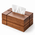 Rectangular geometric tissue box crafted from dark brown wood, with a white tissue peeking from the top slot.