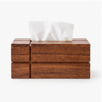 Geometric brown wooden tissue box with a rectangular shape, abstract block design, and a white tissue emerging from the top.