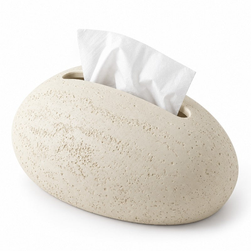 Light beige, pebble-shaped tissue holder with a rough, textured finish and a white tissue emerging from the top slot.