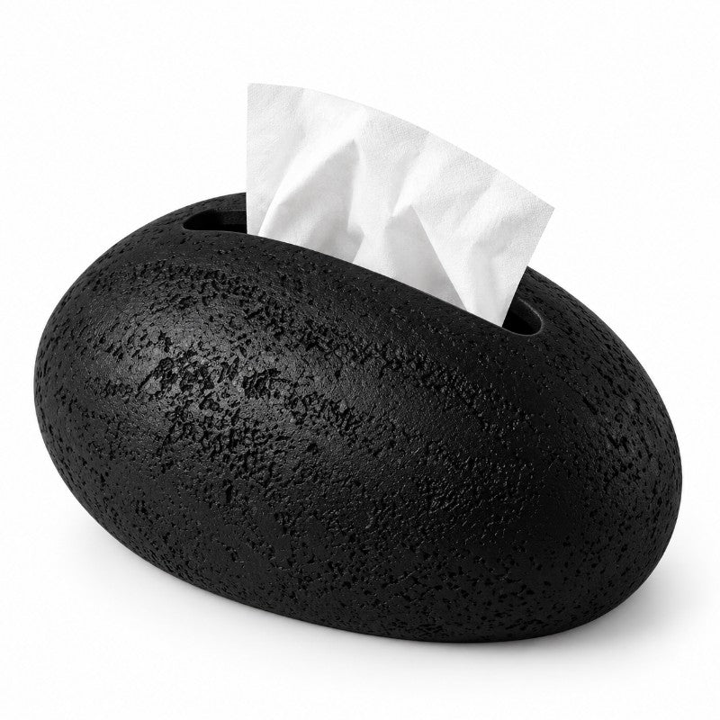 Black, pebble-shaped tissue holder with a rough, textured surface and a white tissue emerging from a top opening.